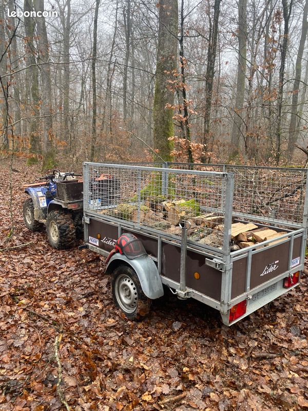 Remorque Lider bois avec rehausses grillagées chargée de bois